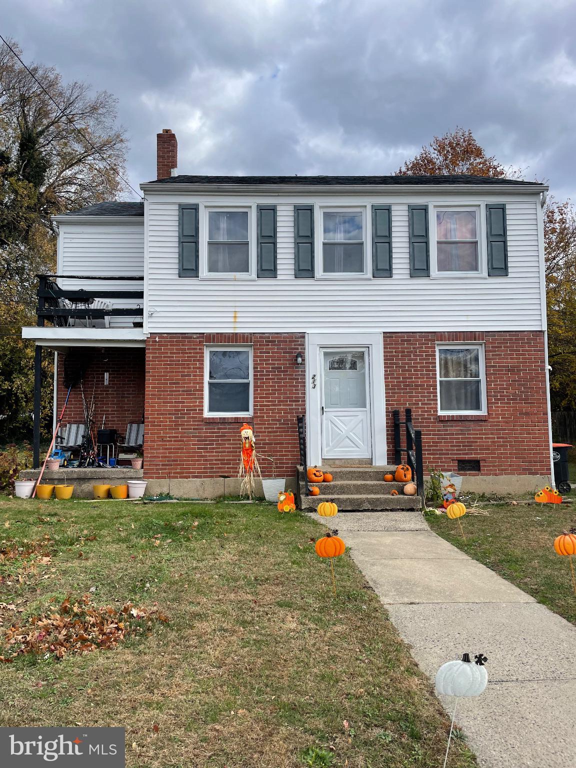 213 Gray Street Chester, PA 19013 - Photo 2 of 38 a front view of a house with a yard