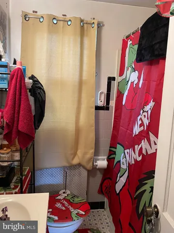 a bedroom with bed and window