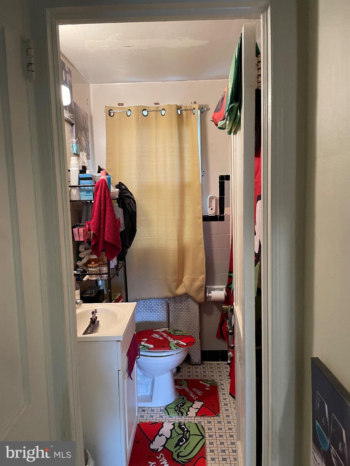 213 Gray Street Chester, PA 19013 - Photo 29 of 38 a view of walk in closet with clothes and shoes