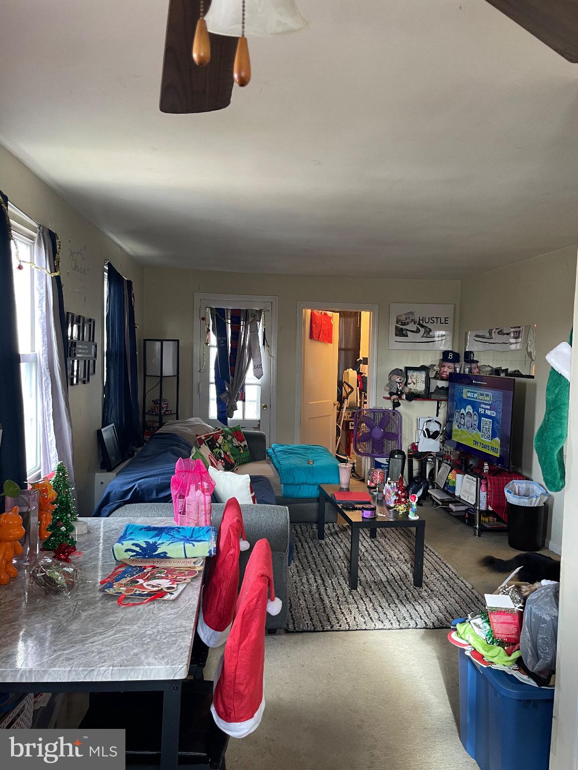 213 Gray Street Chester, PA 19013 - Photo 34 of 38 a living room with furniture and a flat screen tv