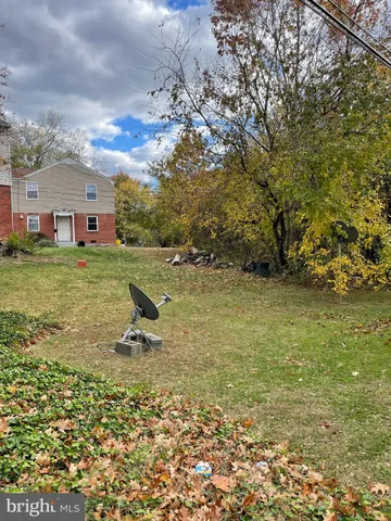 a view of a big yard with a house