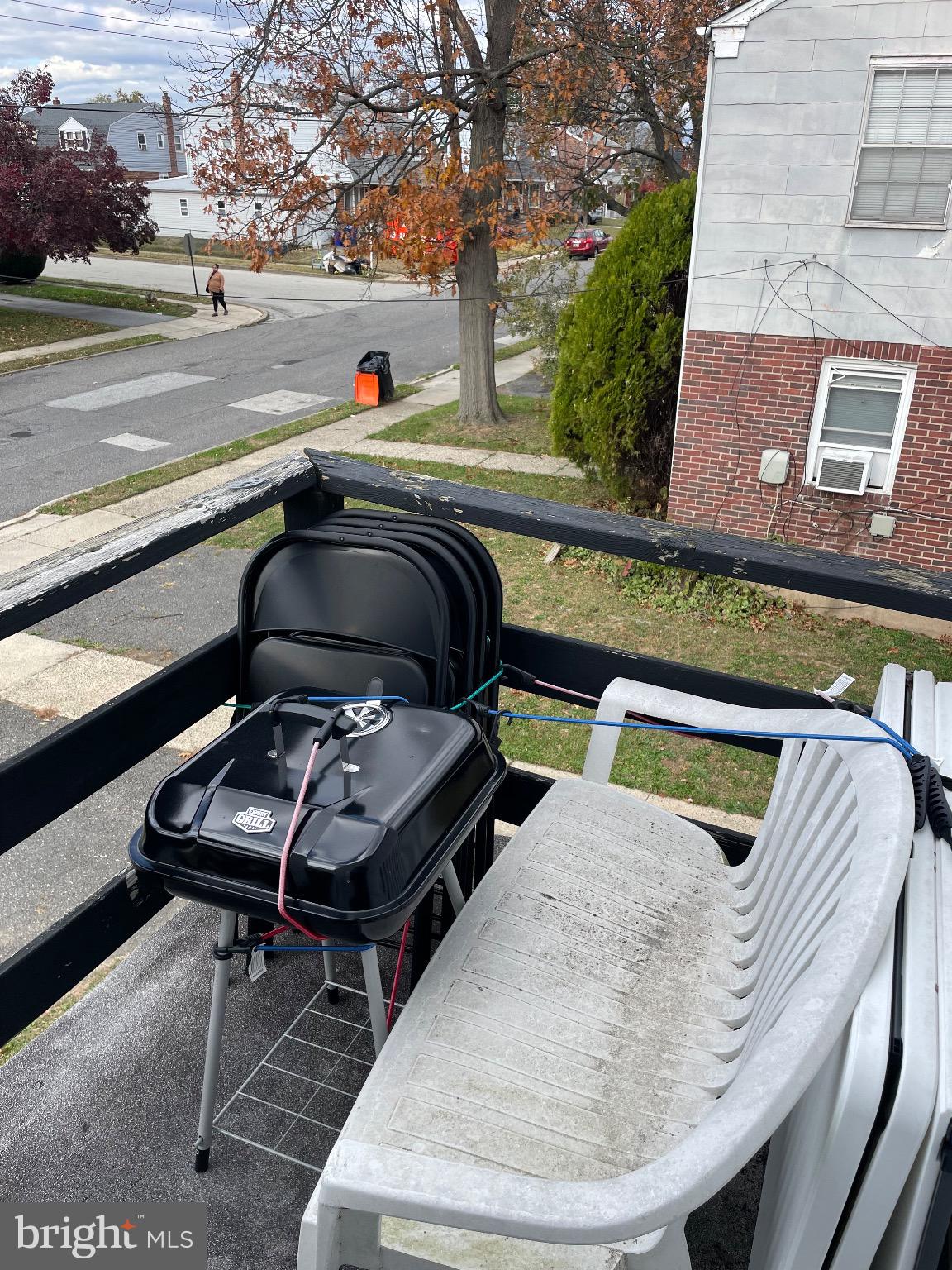 213 Gray Street Chester, PA 19013 - Photo 5 of 38 a view of a couches and table in the balcony