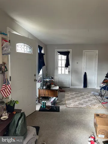 a bedroom with bed and window