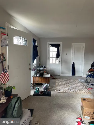 a view of a livingroom with furniture and windows