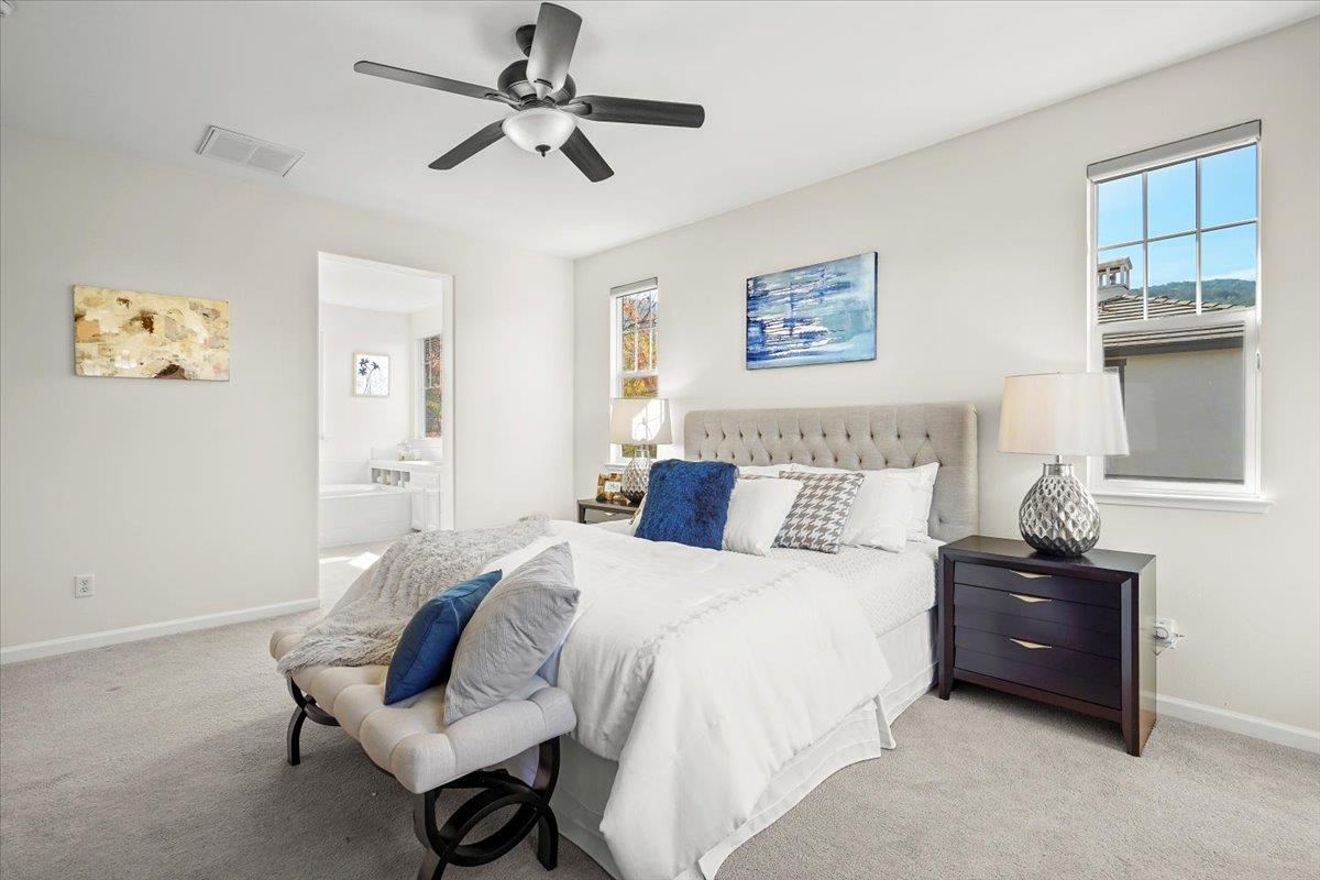 2144 Gullane Way Gilroy, CA 95020 - Photo 10 of 22 a spacious bedroom with a bed and a table