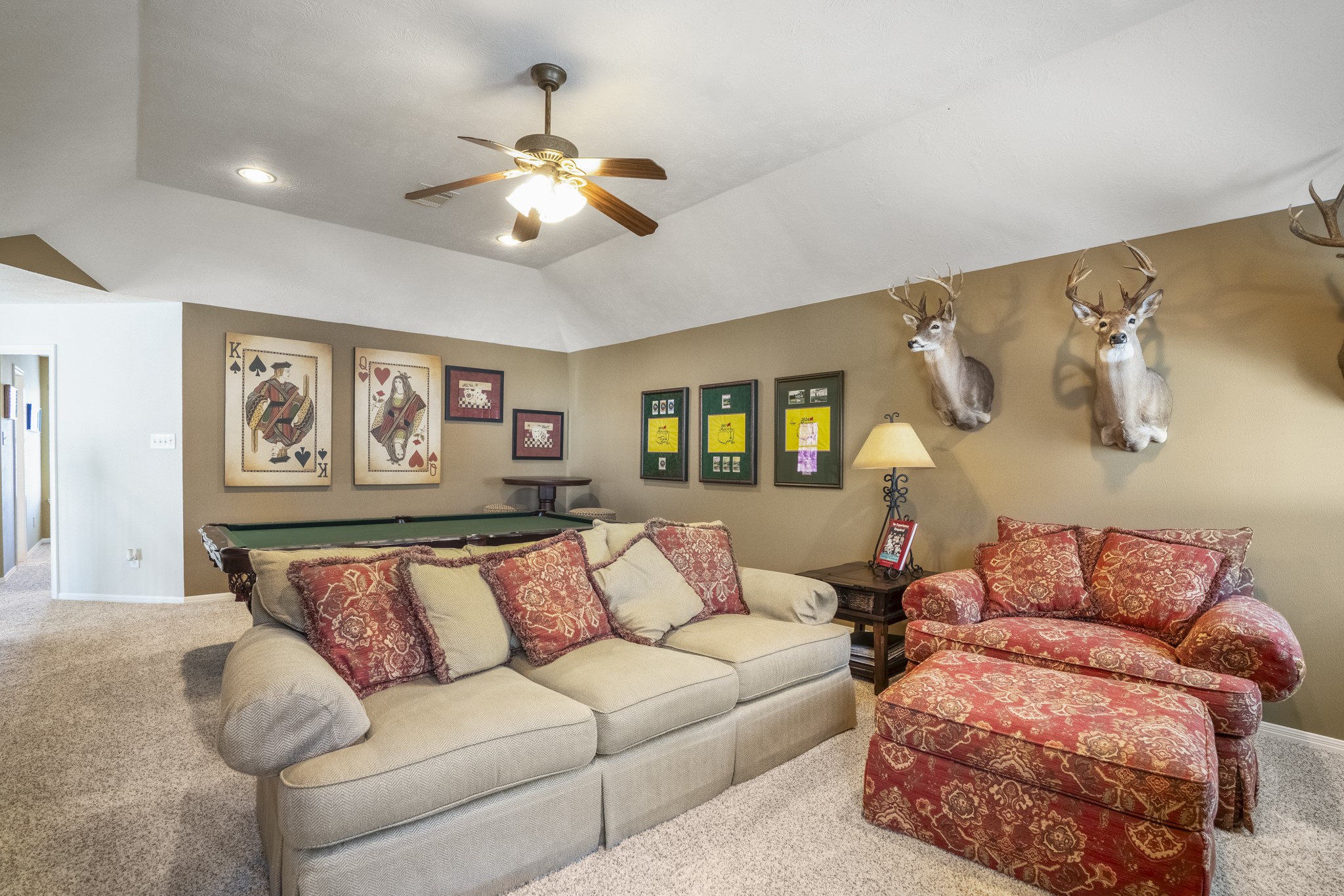 6615 Haughton Drive Spring, TX 77389 - Photo 27 of 50 From this side of the game room, the upstairs level feels like its own separate zone — removed from the main living areas below. It’s the kind of space that naturally becomes a hangout, a movie room, or a place to unwind without interrupting what’s happening downstairs. With the bedrooms just off this area, everything upstairs feels connected yet comfortably set apart.