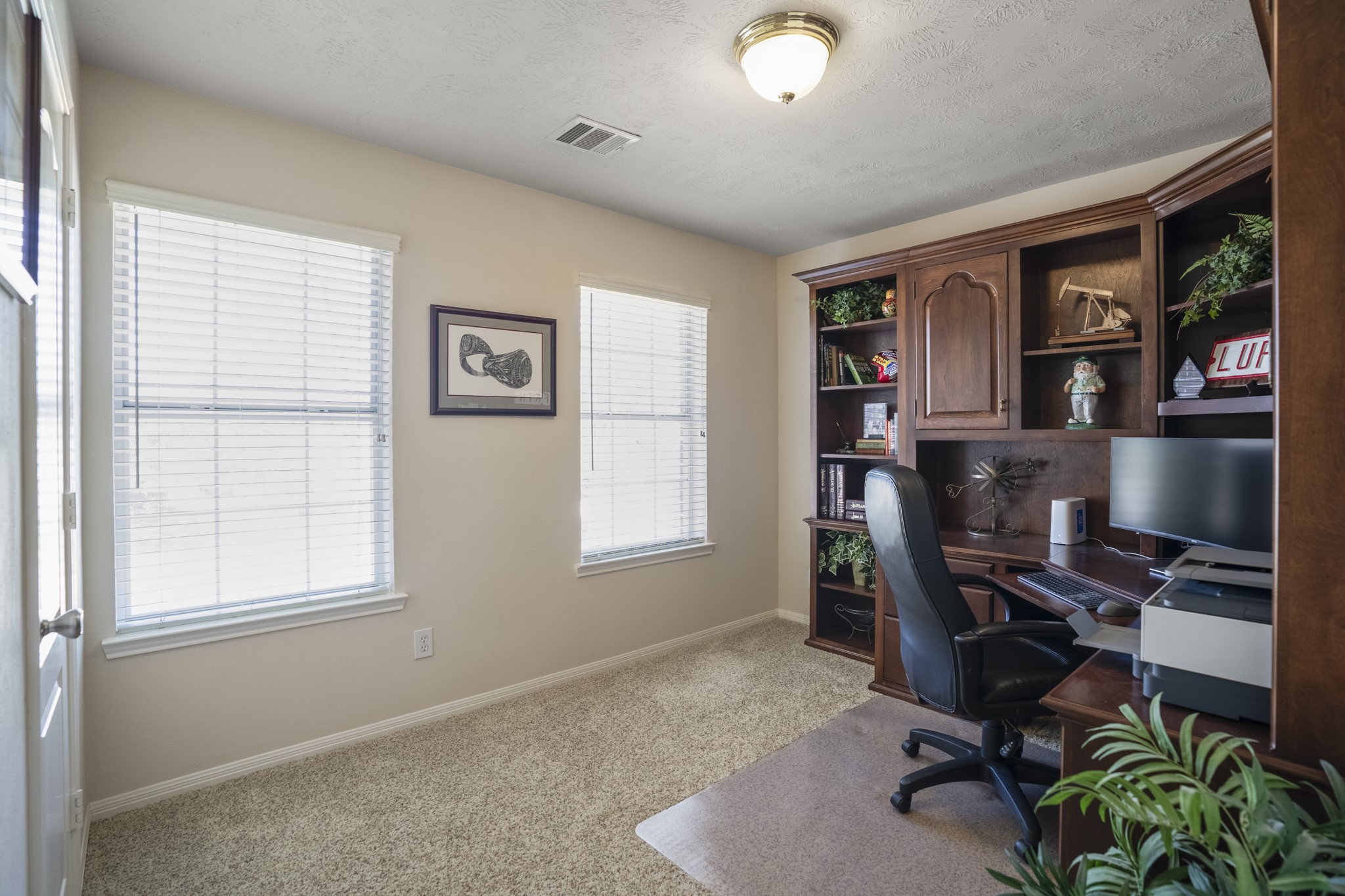 6615 Haughton Drive Spring, TX 77389 - Photo 34 of 50 The third upstairs bedroom has two windows that bring in great natural light from different angles. Like the others, it keeps the same neutral feel and easy flow of the second level.