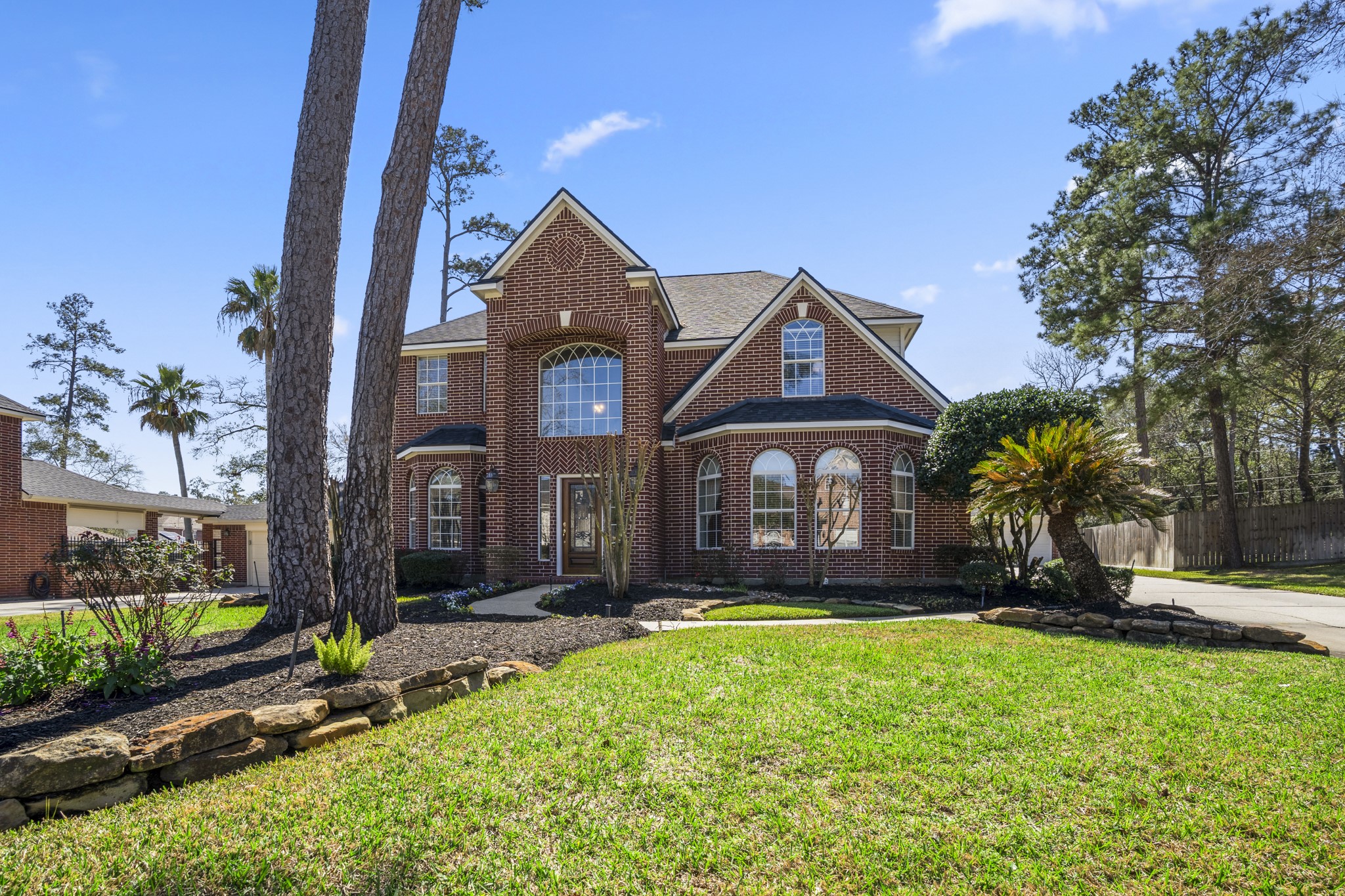 6615 Haughton Drive Spring, TX 77389 - Photo 45 of 50 One more look at the front of the home before we head up for the aerial views. The brick exterior, arched windows, and mature trees give the elevation a sense of presence, while the curve of the cul-de-sac lot adds to its spacious feel. It’s a home that makes a strong first impression — and lives just as beautifully inside.
Next, we’ll take to the sky for a broader view of the property and community.