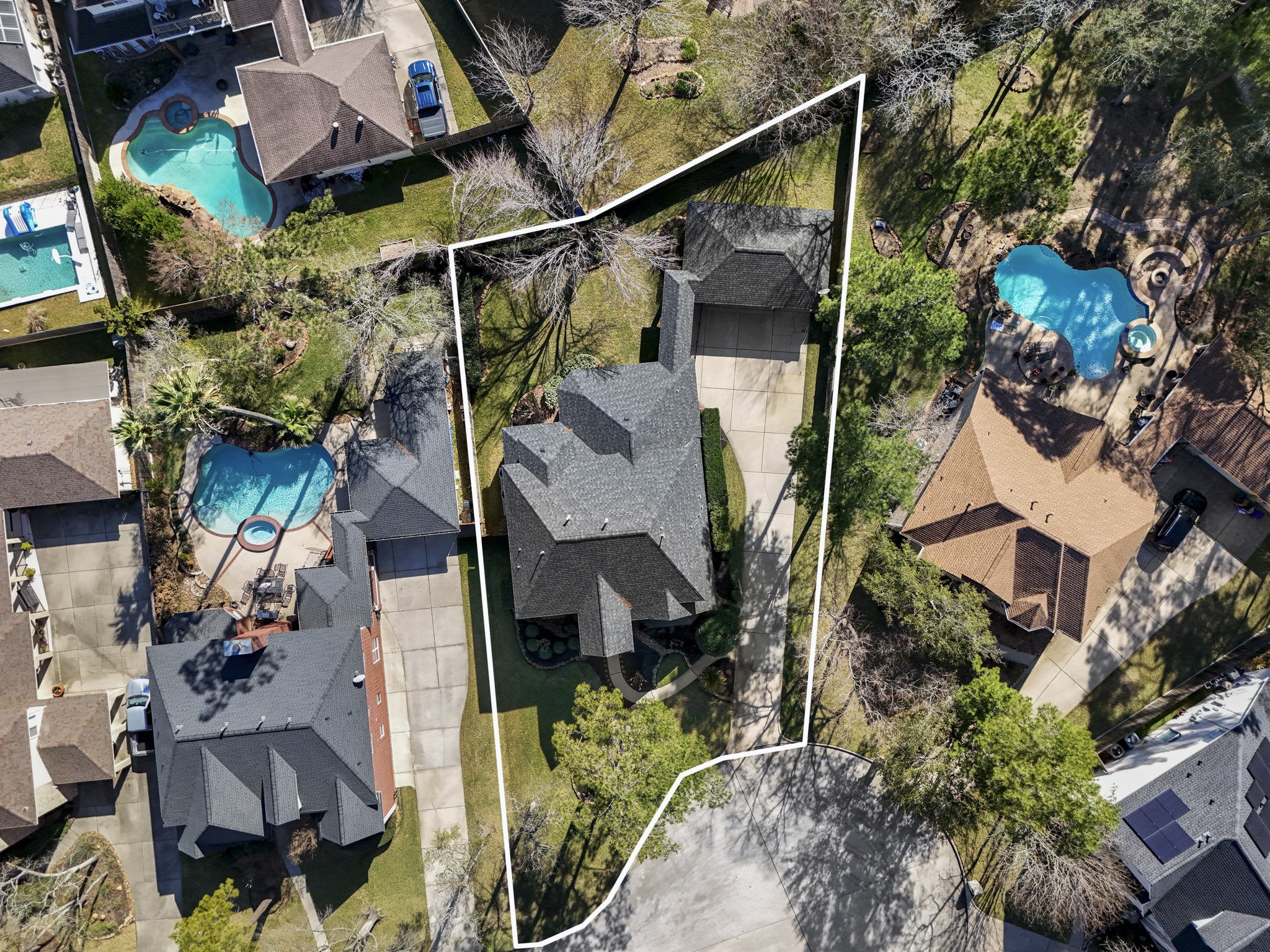 6615 Haughton Drive Spring, TX 77389 - Photo 47 of 50 From directly overhead, the full lot lines are clearly defined, and the depth of the .297-acre cul-de-sac homesite really stands out. The backyard stretches wide and deep behind the home and detached garage, giving you a true sense of the space this property offers.
And from this vantage point, you can also appreciate the roof — replaced in 2023 — looking sharp and well maintained from every angle.