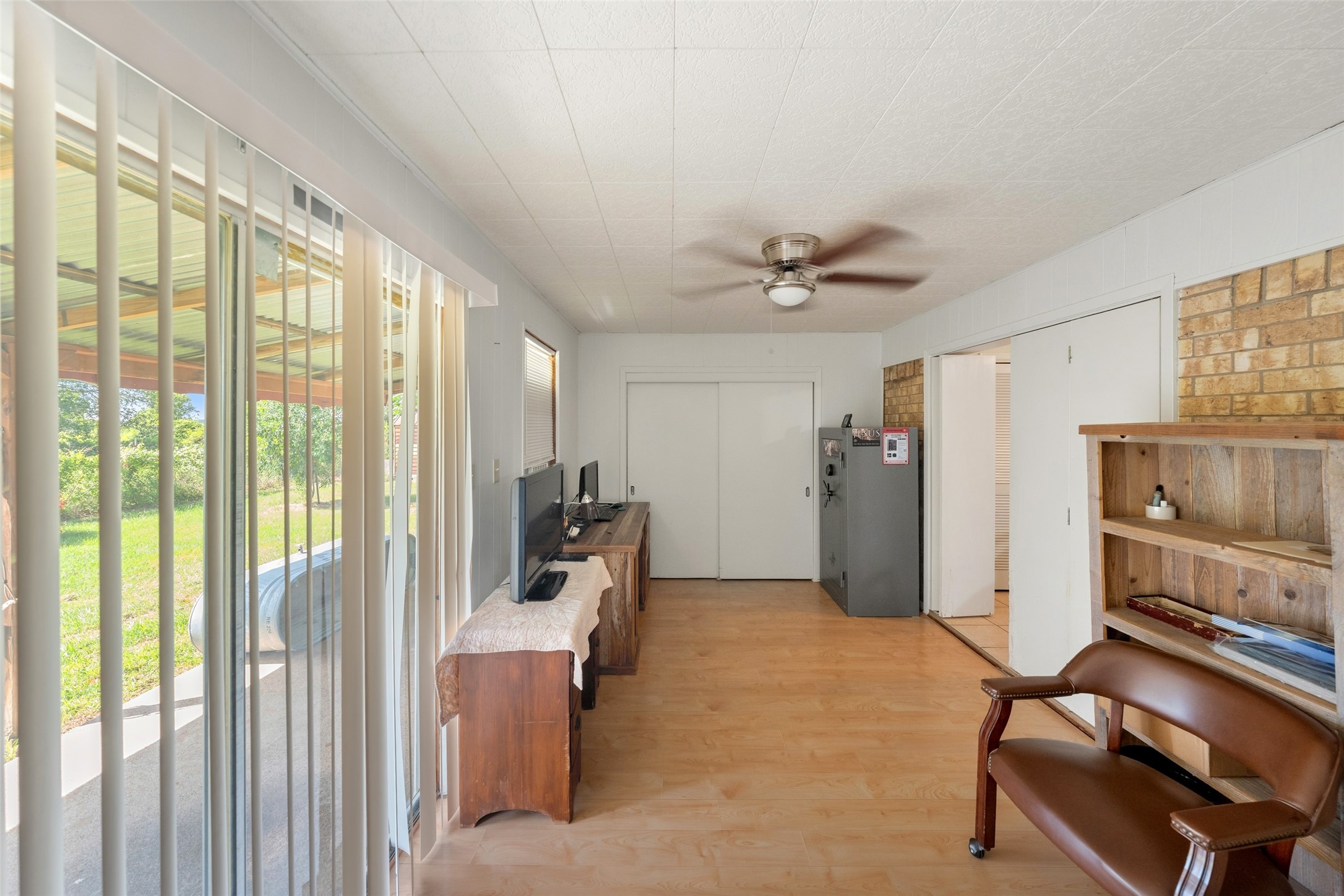 25739 Old Howth Road Hempstead, TX 77445 - Photo 18 of 36 Need a place to work, play or spread out a little? This versatile room offers easy access to the kitchen, plenty of natural light and sliding glass doors that open to the covered patio and 5 peaceful acres, creating a flexible space that can adapt to the way you live.