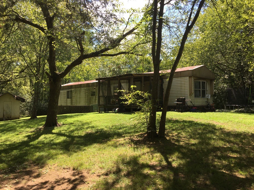 9800 Florence Road Smyrna, TN 37167 - Photo 3 of 8 a view of a yard in front of a house with large tree