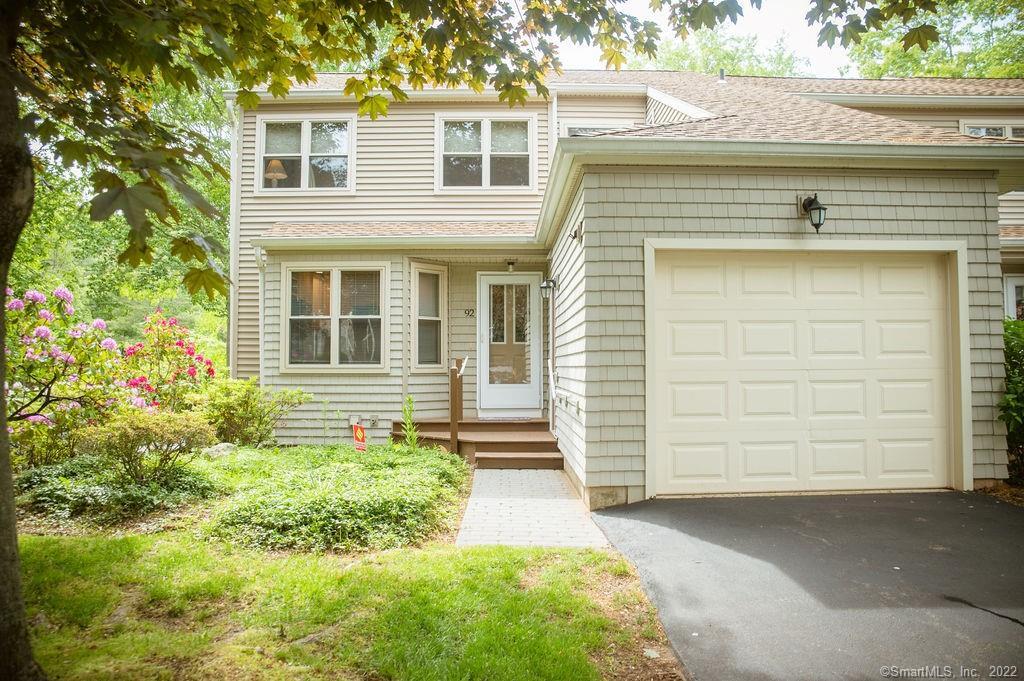 End unit three level Townhouse with primary bedroom suite on main level