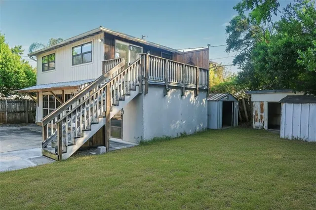 a view of backyard with deck and deck