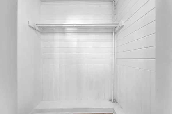 a bathroom with a sink toilet and a mirror