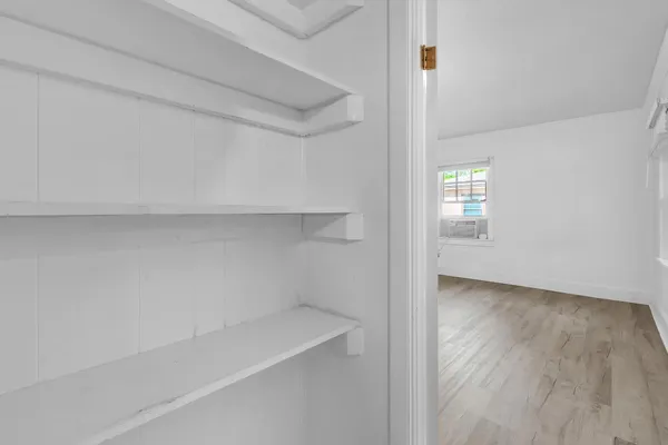 a view of an empty room with a window