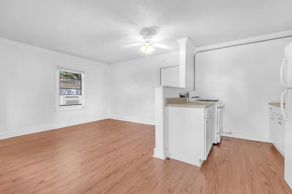 a white refrigerator freezer sitting inside of a kitchen