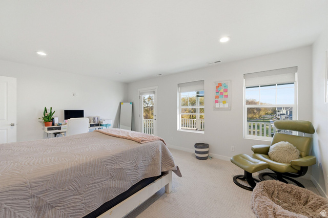 1038 South Old Towne Road Layton, UT 84041 - Photo 16 of 39 Bright room featuring two large windows with roller shades, recessed lighting, and light-toned carpeting