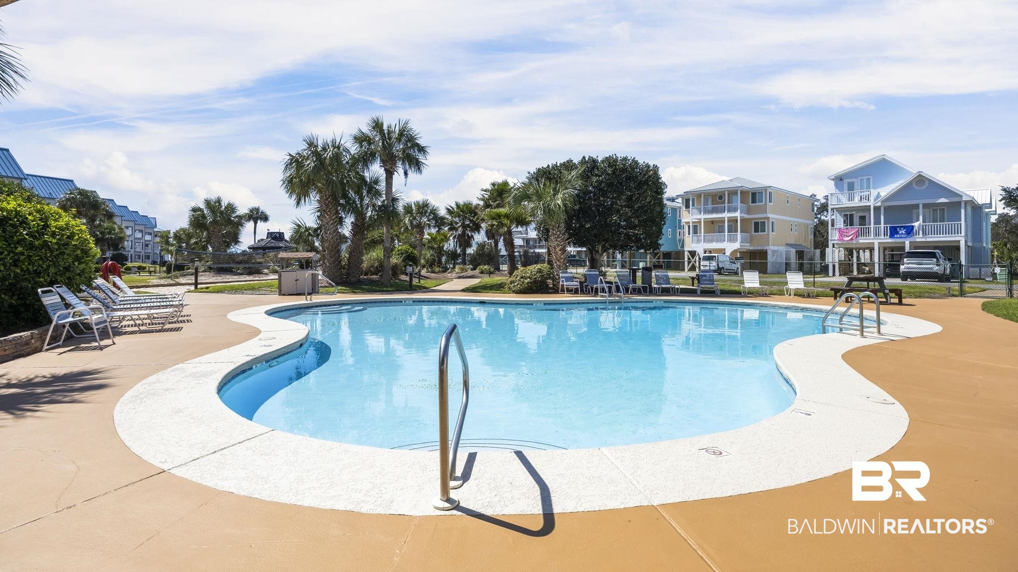 497 Plantation Road, Unit 1247 Gulf Shores, AL 36542 - Photo 21 of 29 Community pool featuring a patio area