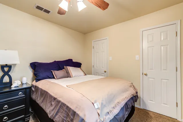 a view of a house with backyard sitting area and garden
