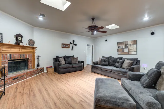 a living room with a flat screen tv and a fireplace