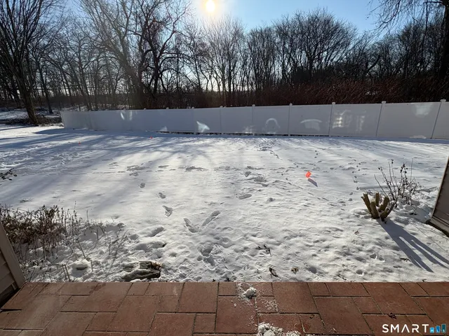 a view of wooden fence of a house