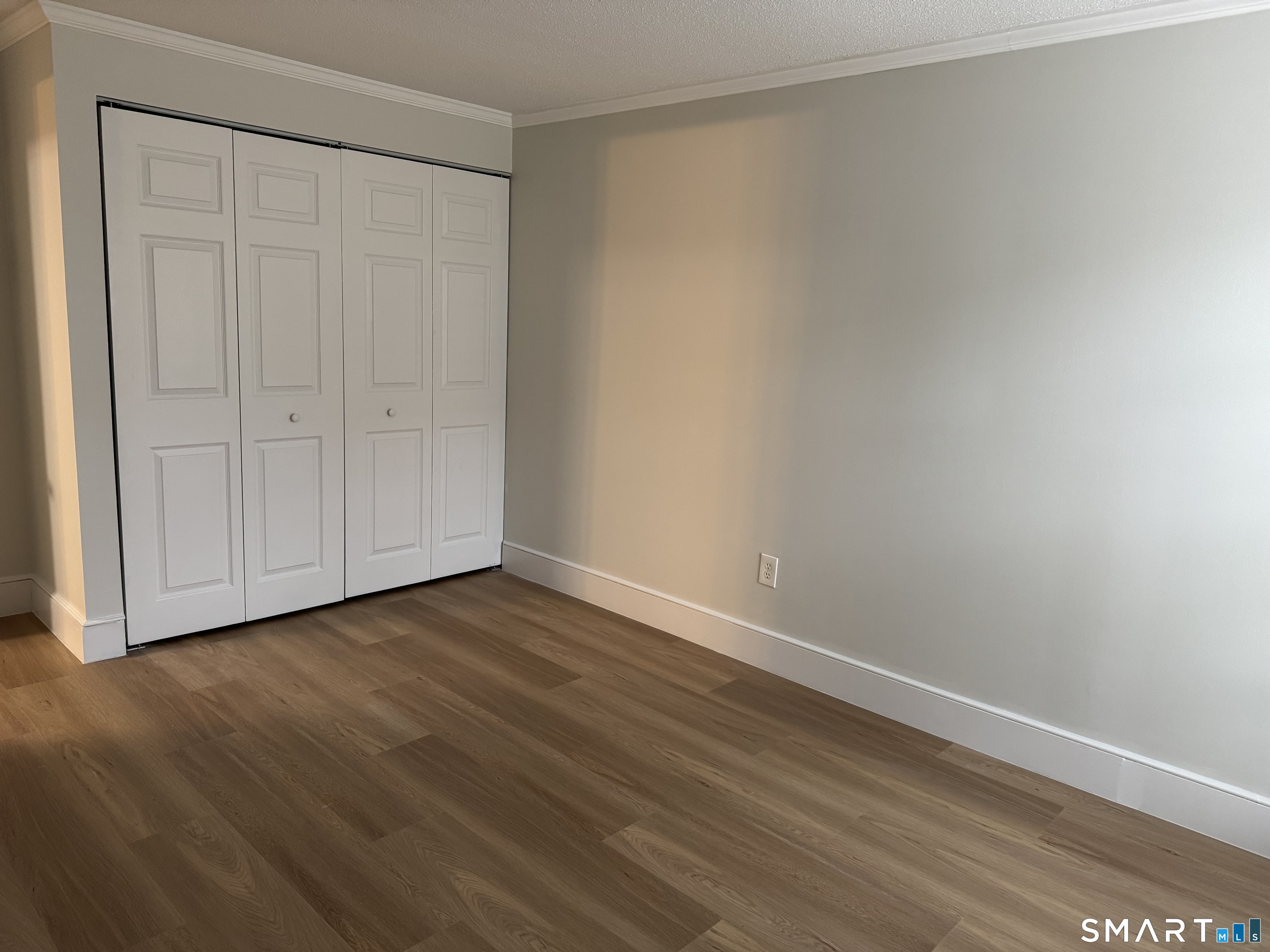 8 Heather Ridge, Unit 8 Shelton, CT 06484 - Photo 6 of 13 a view of an empty room with wooden floor