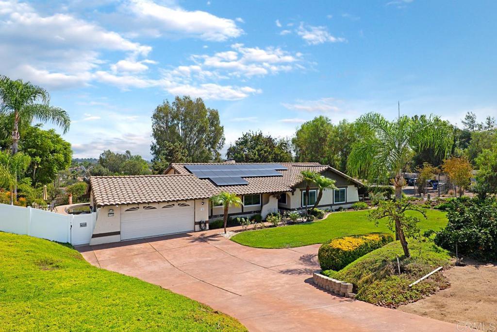 3736 Olive Hill Road Fallbrook, CA 92028 - Photo 1 of 1 a view of a house with a big yard plants and large tree