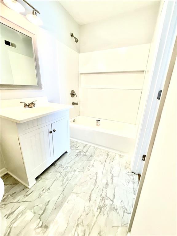 4701 Flat Shoals Road, Unit 68D Union City, GA 30291 - Photo 12 of 14 a bathroom with a tub sink and a mirror