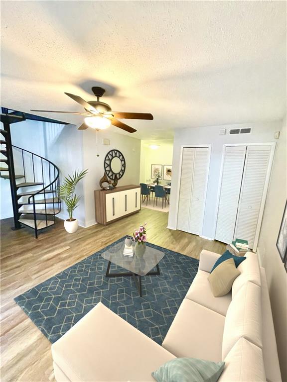 4701 Flat Shoals Road, Unit 68D Union City, GA 30291 - Photo 4 of 14 a living room with furniture and a wooden floor