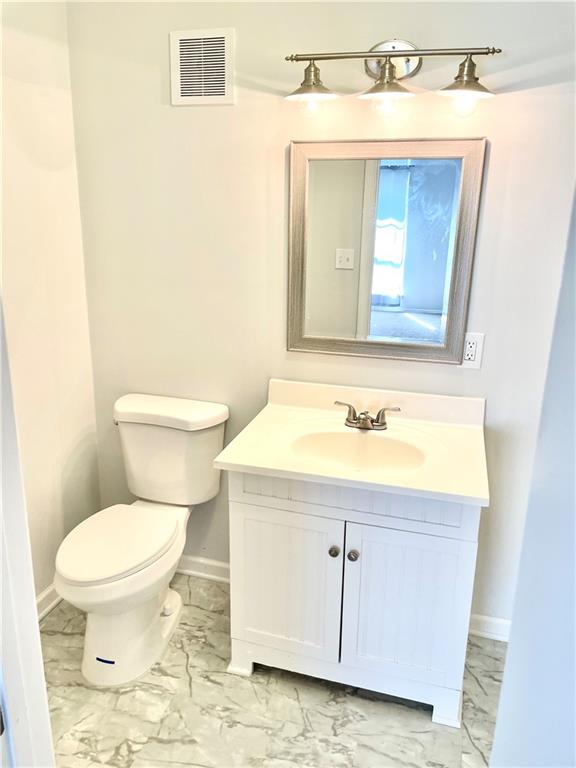 4701 Flat Shoals Road, Unit 68D Union City, GA 30291 - Photo 10 of 14 a bathroom with a sink toilet and mirror