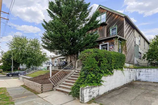 a view of a house with brick walls