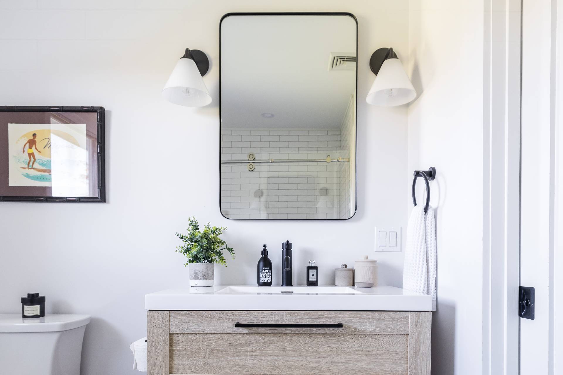 21 Thistle Patch Lane Sag Harbor, NY 11963 - Photo 11 of 17 a bathroom with a shower sink and mirror