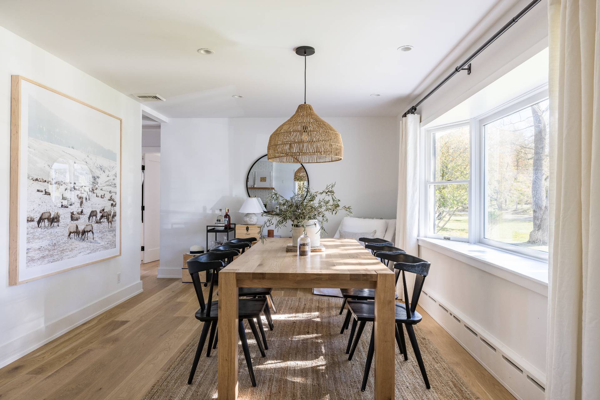 21 Thistle Patch Lane Sag Harbor, NY 11963 - Photo 5 of 17 a dining room with furniture a chandelier and wooden floor