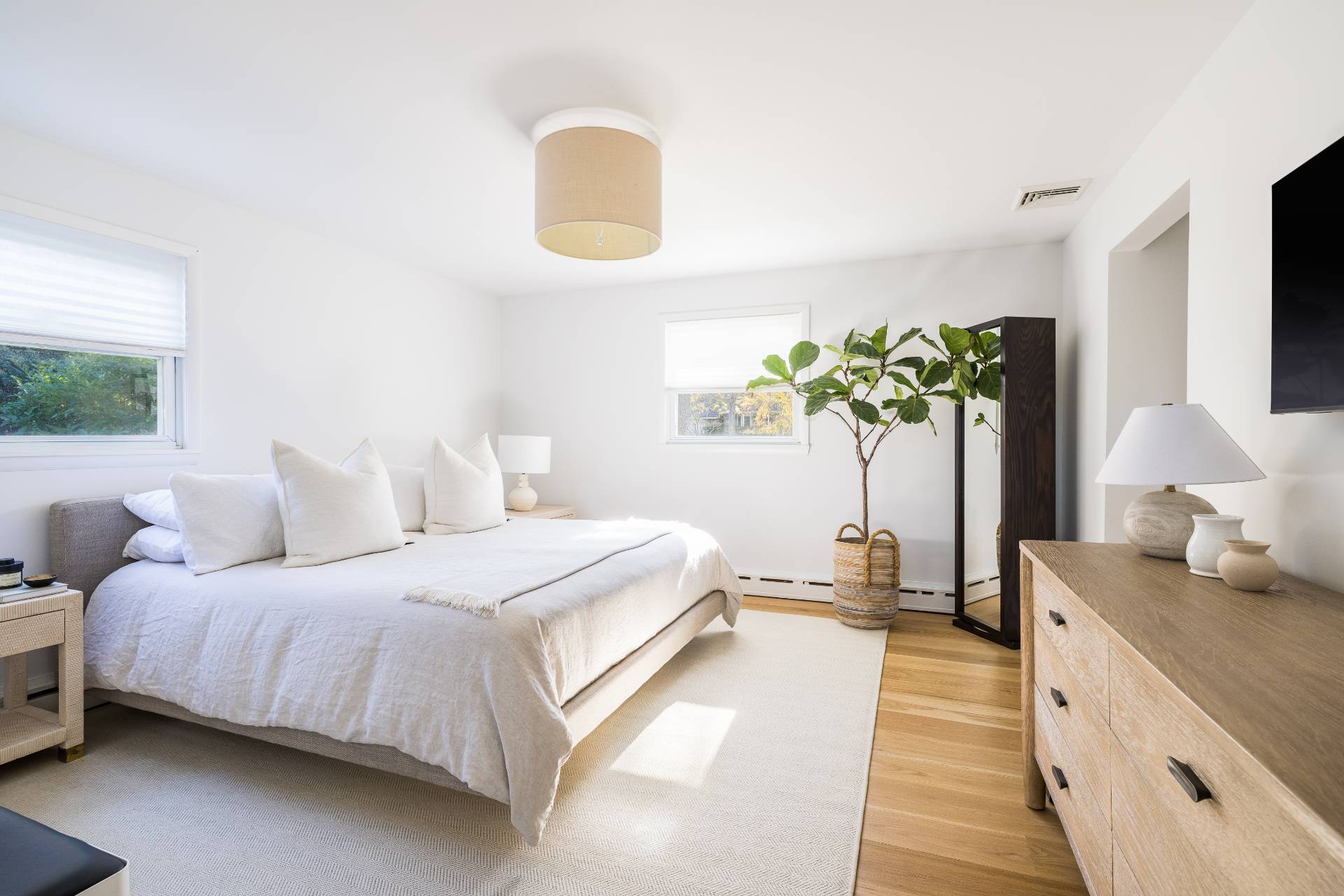 21 Thistle Patch Lane Sag Harbor, NY 11963 - Photo 6 of 17 a bedroom with bed and a large windows