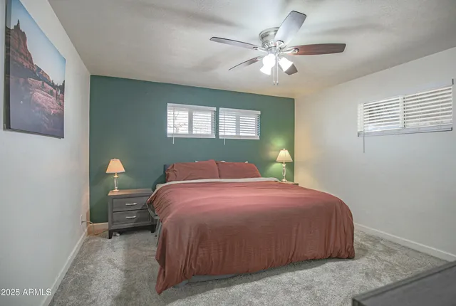 a bedroom with a bed and window