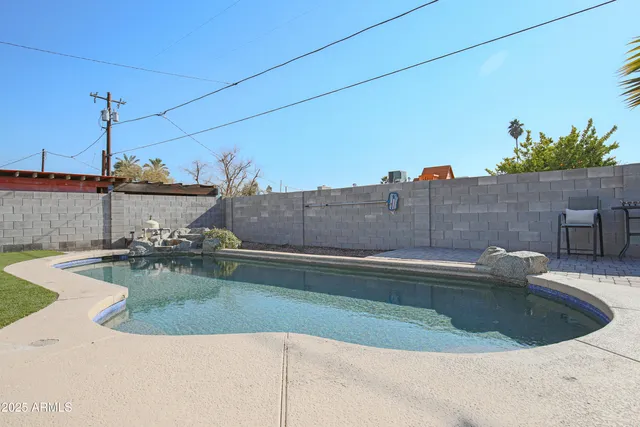 a view of a swimming pool with a patio