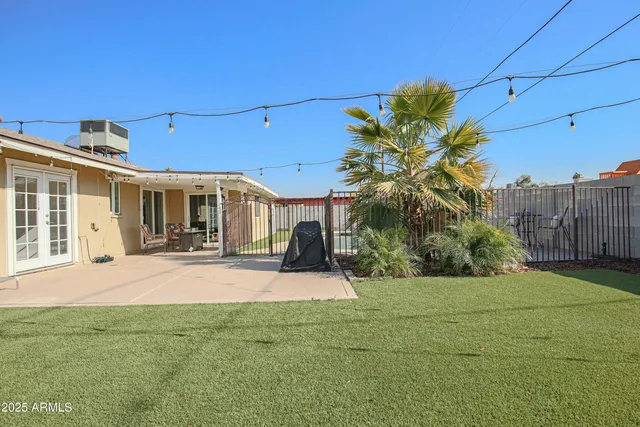 a view of a house with entertaining space and a garden