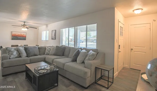 a living room with furniture and a window