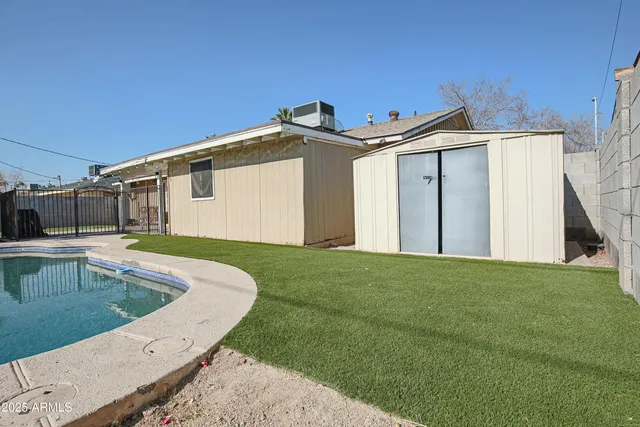 a view of a house with a sink and a yard