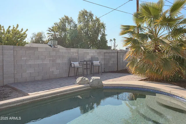 a view of a wooden fence with a bench