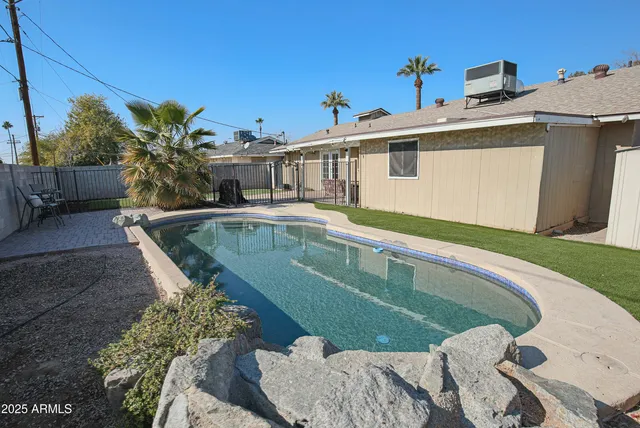 a view of a house with swimming pool