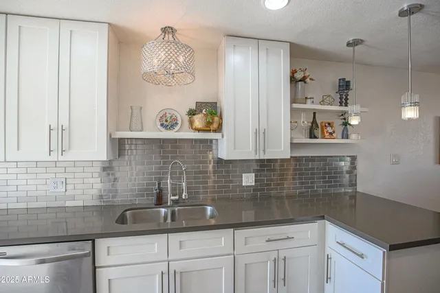 a kitchen with a sink and cabinets