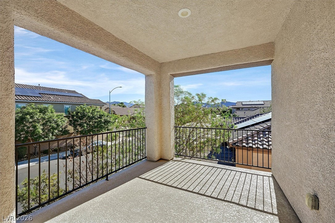 1106 Langston Ranch Avenue Henderson, NV 89002 - Photo 13 of 36 Unwind on this spacious balcony offering neighborhood vistas and clear skies.