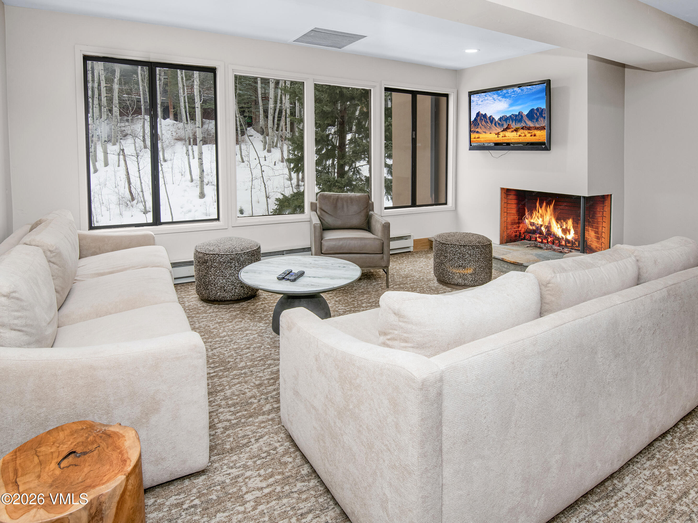 1650 Fall Ridge Road, Unit 202 Vail, CO 81657 - Photo 22 of 32 a living room with furniture and a large window