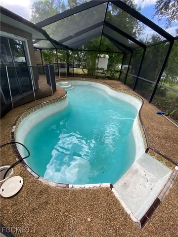 a view of a backyard with sitting area
