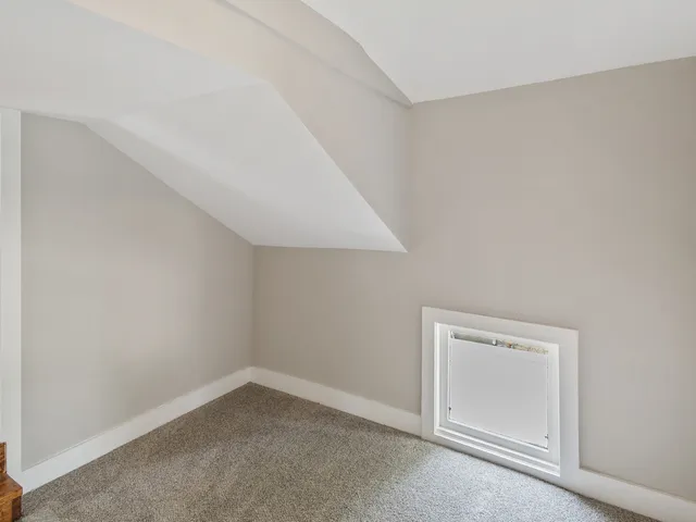 an empty room with a empty space and window