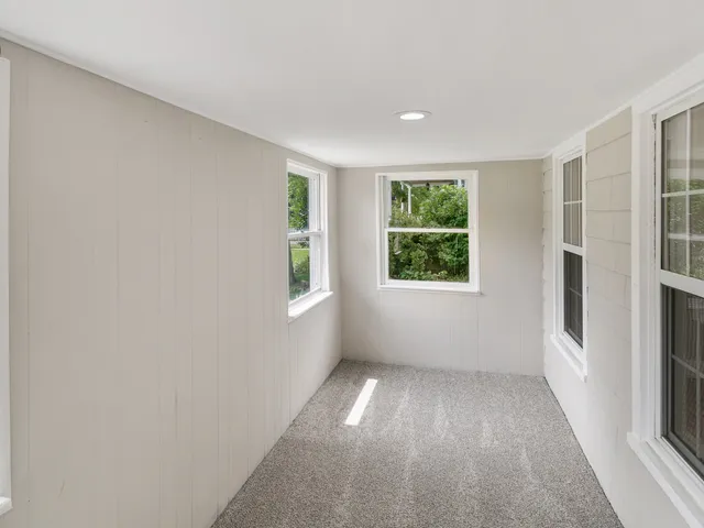 an empty room with windows