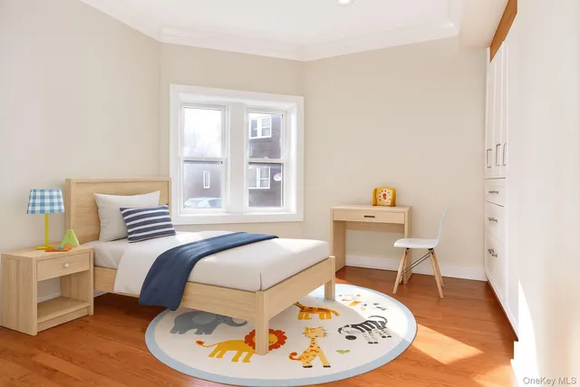 a bed room with a bed and a chair