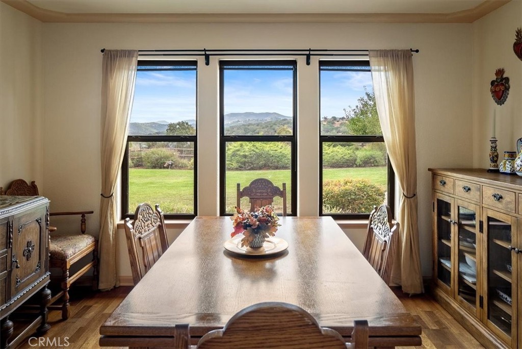 a view of a dining room with furniture window and outside view