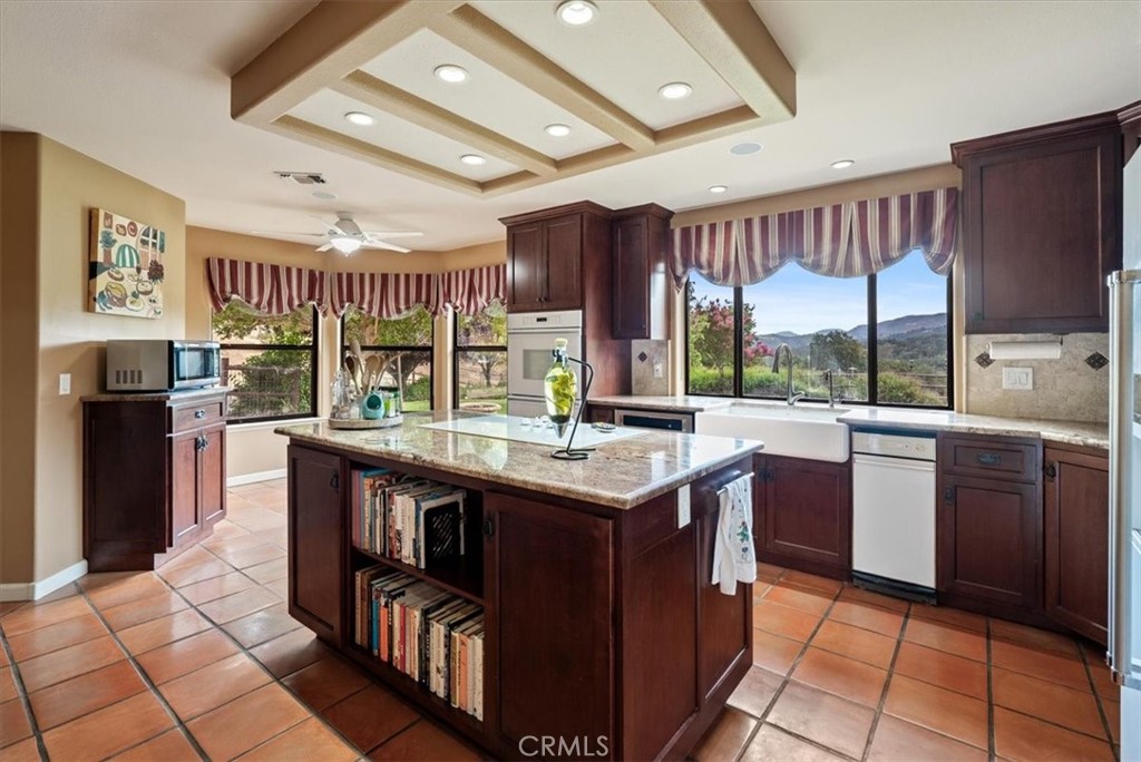 2955 San Fernando Road Atascadero, CA 93422 - Photo 14 of 62 a kitchen with stainless steel appliances granite countertop sink stove top oven and cabinets